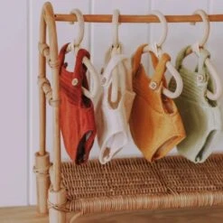 Olli Ella | Dinkum Doll Romper | Mustard -Simple Play Stories Olli Ella Dinkum Doll Romper Mustard on Rattan Clothing Rack